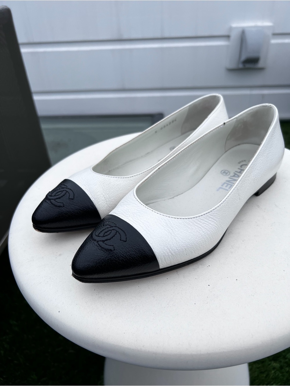 CHANEL White Leather Pointed Toe Flats with Black Cap Toe